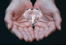 Diamond In Hands With Hand Reflections
