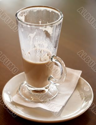 Coffee Latte in a tall glass half empty