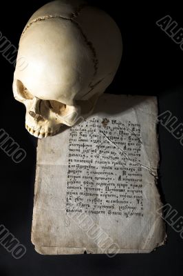 cranium and old manuscript