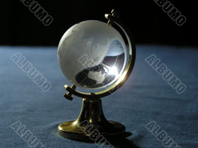 Souvenir. The glass globe on a metal support.