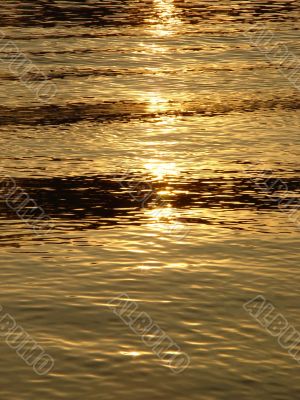 Background. Solar sparks on water.