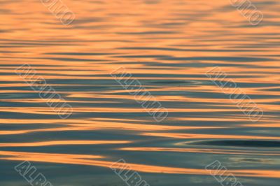 Background. Solar sparks on water.