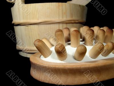 Massage brush in a wooden bucket