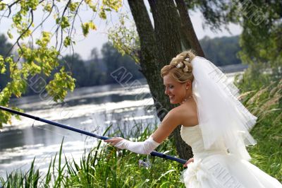 Bride with a fishing tackle