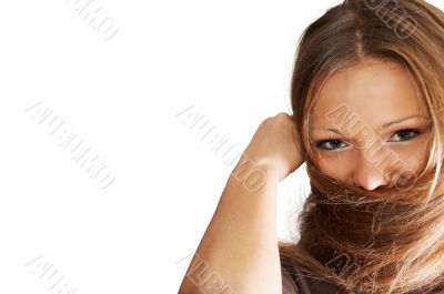 young woman playing with hair. isolated.