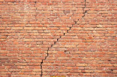cracked redbrick wall