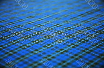 blue checkered fabric background. shallow DOF.