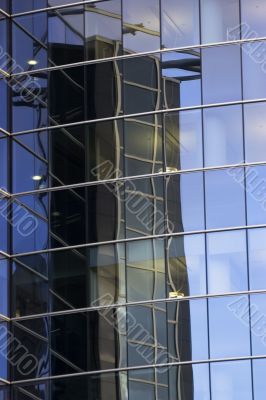 Reflections of office skyscraper