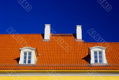 Orange roof against blue sky