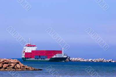 Cargo ship with red containers