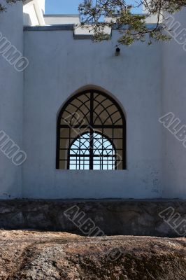 Fragment of a wall of a chapel with a window