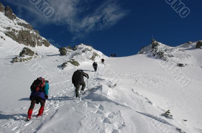 A team climbing a high mountain