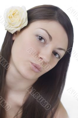 Girl with a white rose behind an ear