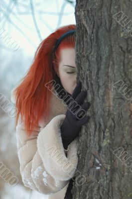 sad girl near a tree