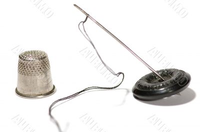 thimble with sewing needle