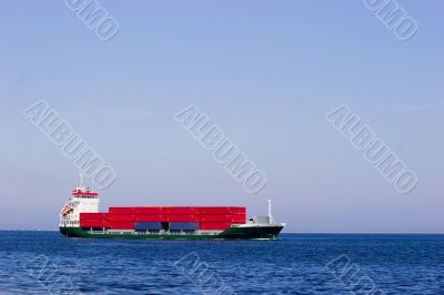 Cargo ship with red containers