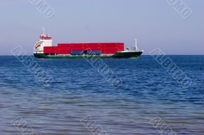 Cargo ship with red containers
