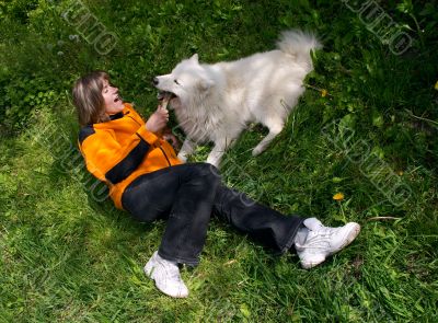 Girl playing with dog