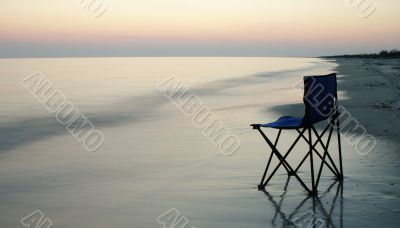 Folding chair on a seaside