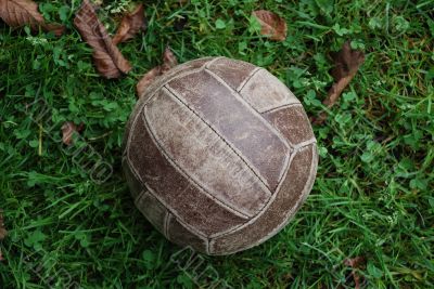 Old volleyball ball on grass Old volleyball ball on grass