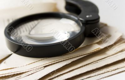 Magnifier and newspaper