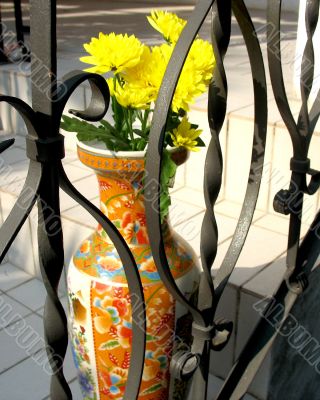 A Vase Behind The Fence