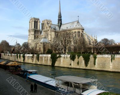 Quay of Paris with a kind on Notre Dame