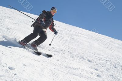 Skier with ski pole on snow and blue sky