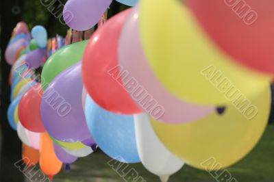  	garland of multi-coloured balloons
