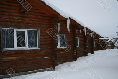 wooden small houses in the winter