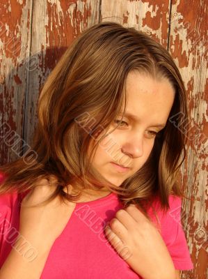 The girl in beams of the coming sun