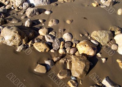 Stone mosaic on marine sand