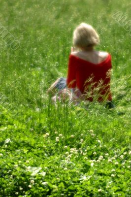 The woman sitting on a glade