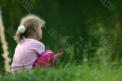 Girl on a coast of lake