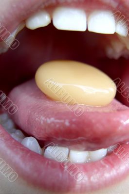 Child`s Mouth with Bonbon