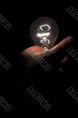 Holding a Light Bulb