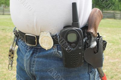 a little boy playing policeman