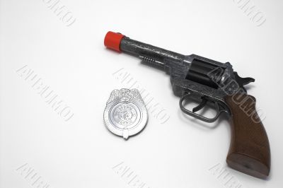 toy gun and badge