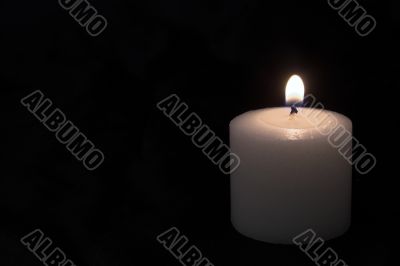 candles burning in a dark room