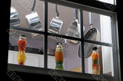 pots and pans in a kitchen window