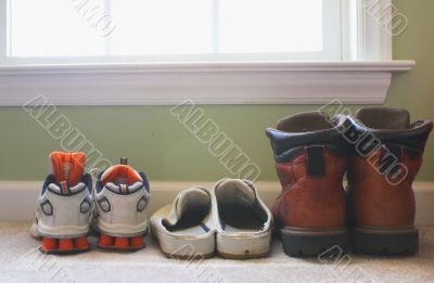 a families shoes lined up in a row
