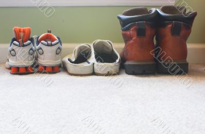 a families shoes lined up in a row