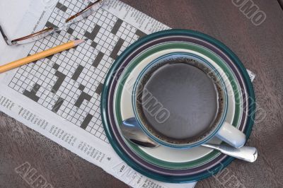 a cup of coffe and the morning crossword puzzle