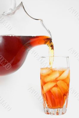 delicious iced tea pouring into a glass