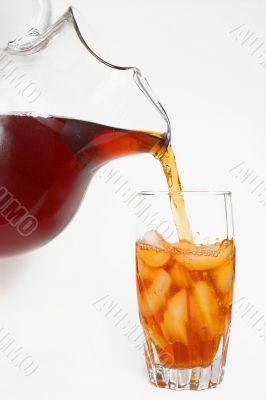 delicious iced tea pouring into a glass