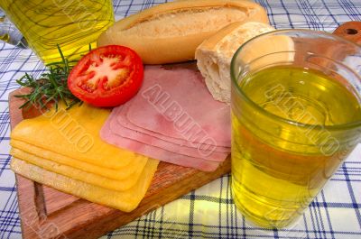 Snack with bread, cheese, ham and juice