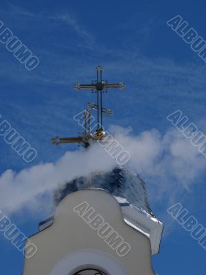 Church Crosses inside white cloud on blue sky