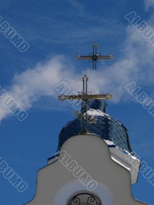 Church Crosses inside white cloud on blue sky