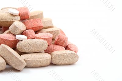 pile of various pills isolated on white