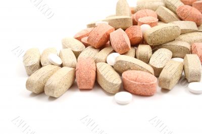 pile of various pills isolated on white